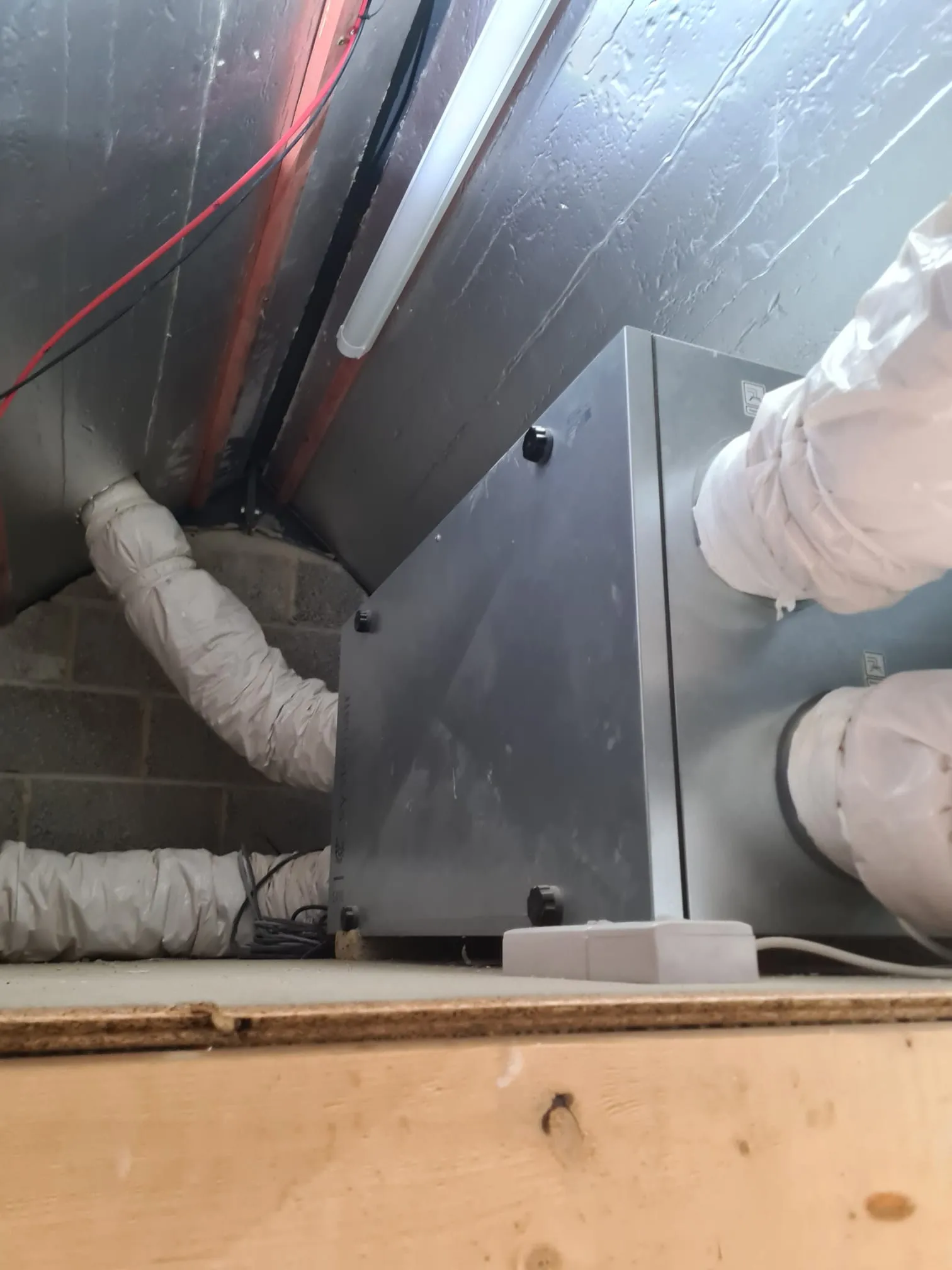 MVHR ventilation unit in a loft space from a different angle