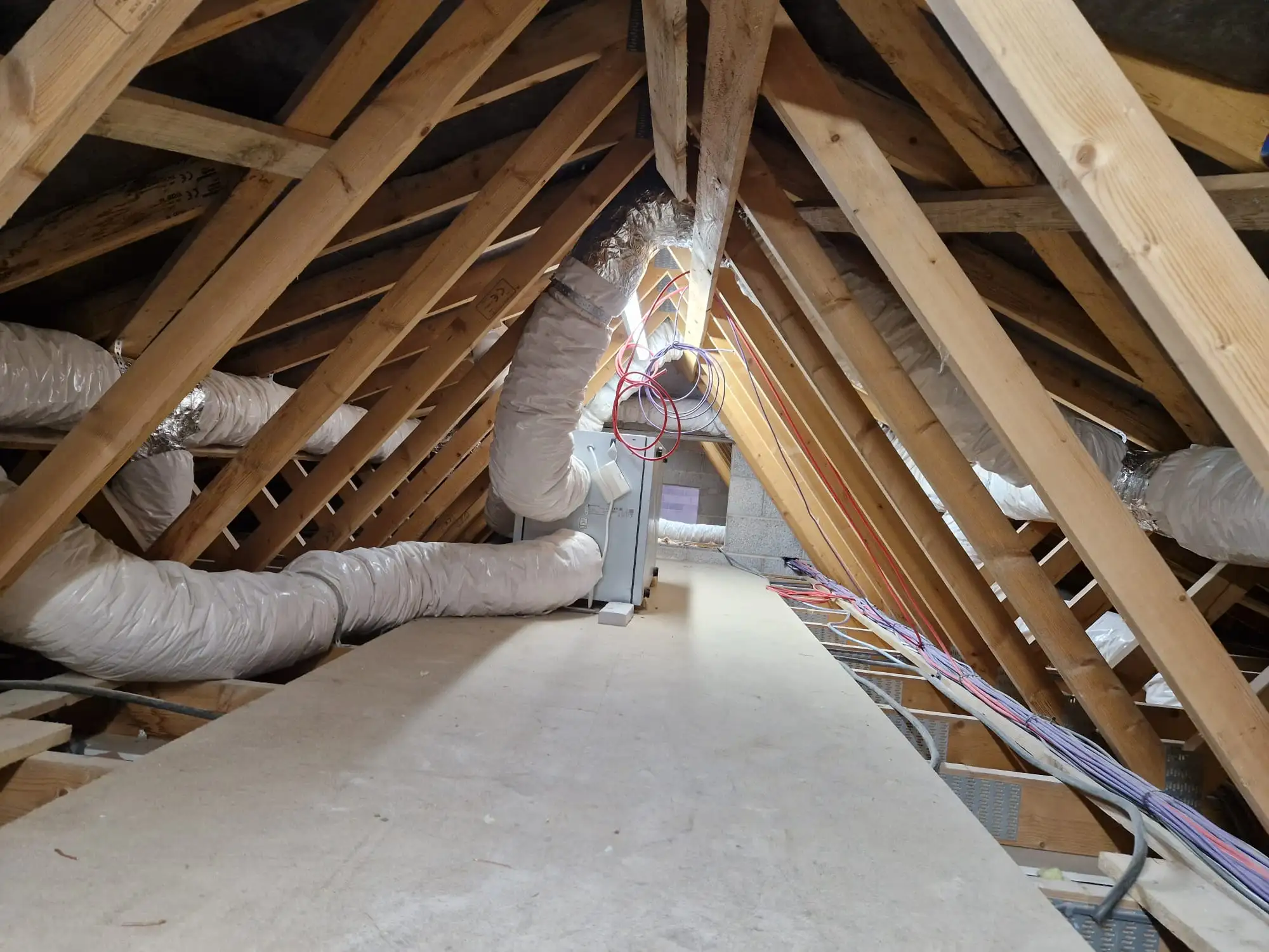 MVHR ductwork running through a residential loft space
